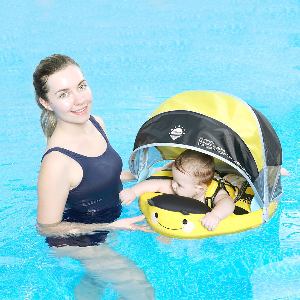 Babyfloat zonder lucht Mambobaby™ Bij – Gele babyfloat zonder lucht met baby, zwemmend in het zwembad