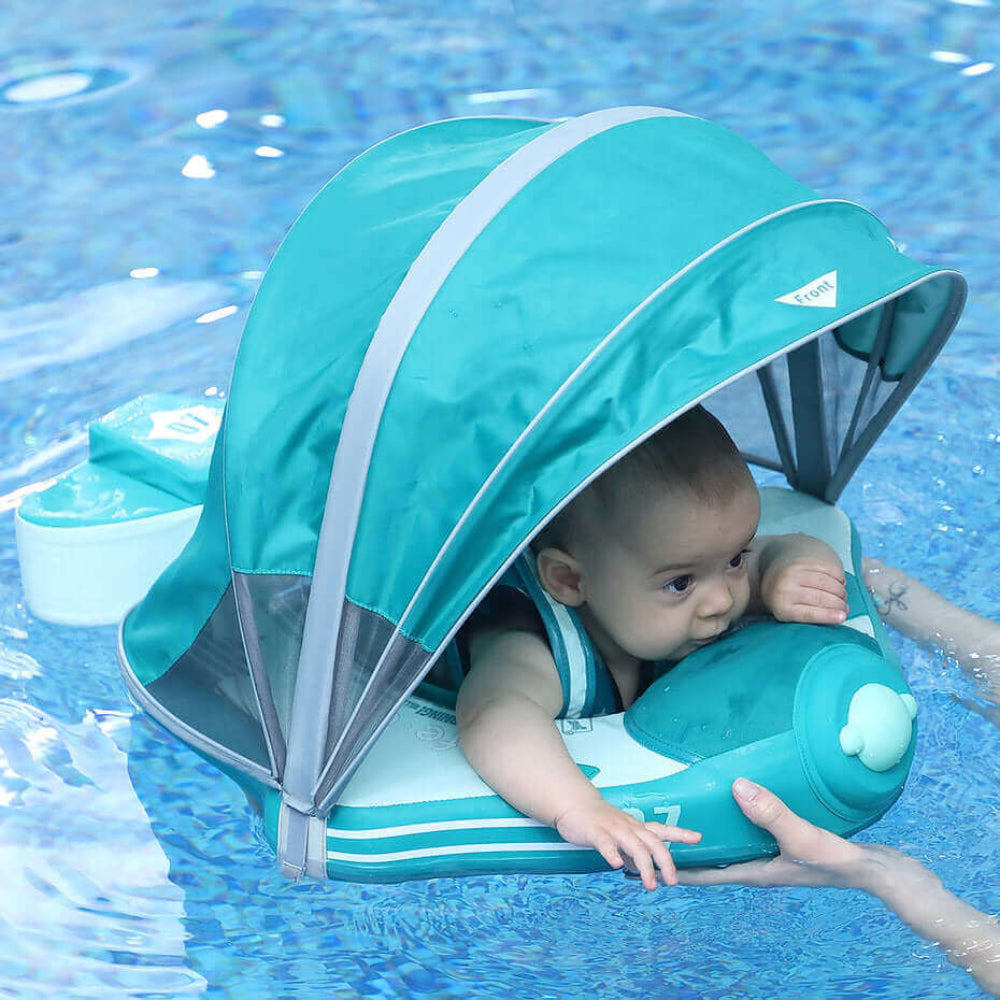 Luchtvrij babyfloat Mambobaby™ Vliegtuig Ontdekker – Drijfstoeltje met blauwgroene zonnekap, harnas en kussentje voor de...