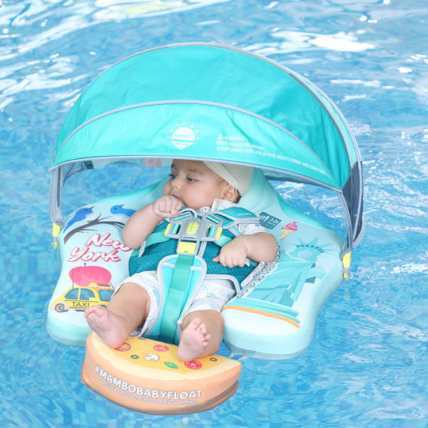 Babyfloat zonder lucht Mambobaby™ New York – Drijfhulp met turquoise UV-dak, 5-punts harnas en bedrukte hoes
