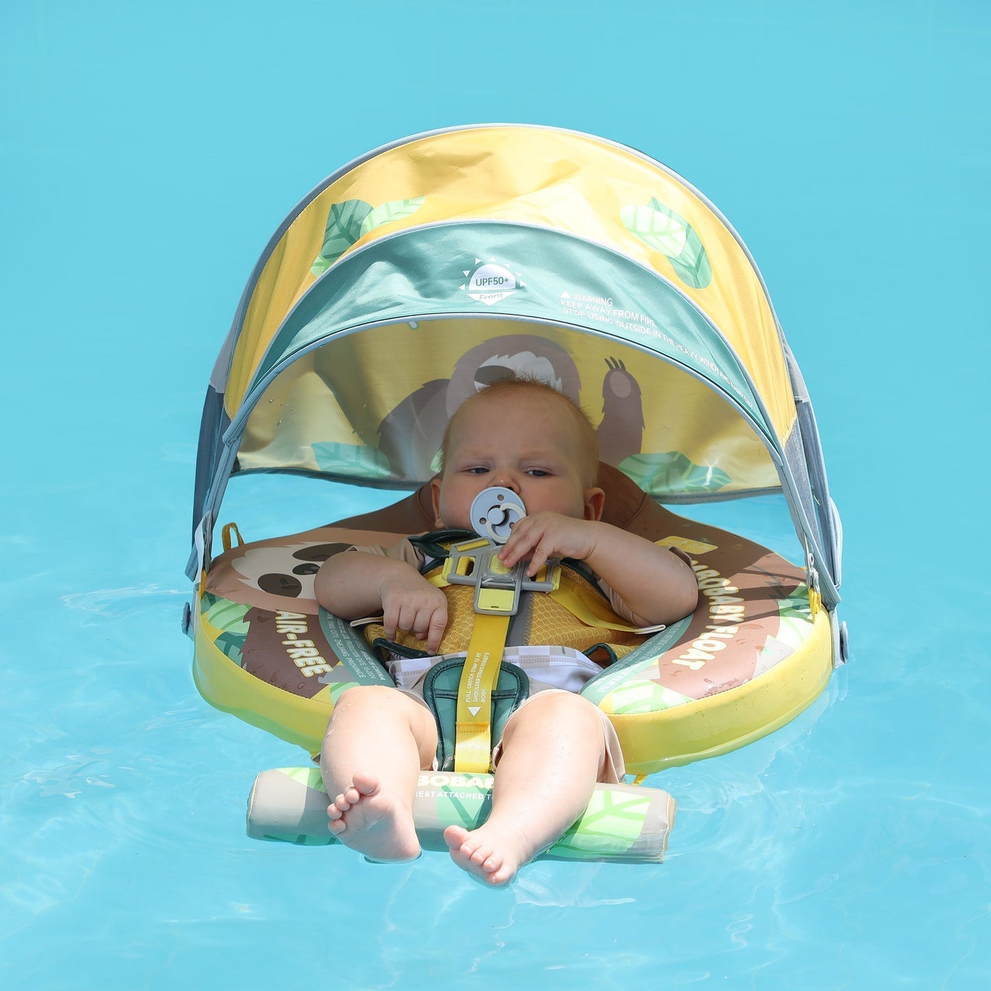 Mambobaby™ Luiaard babyfloat – Niet-opblaasbaar drijfhulpje met doorzichtige groen/gele zonnekap, baby vastgezet met...